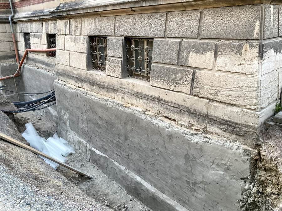 Basement wall waterproofing Waterproofing coating being applied to a basement wall to stop moisture and water ingress